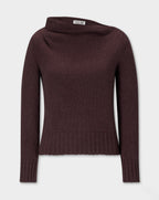 Claude Knite, dark brown knit sweater with a wide draped neckline, long sleeves, and a ribbed hem and cuffs, shown against a light gray background.