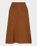 Kingma Skirt, rust-brown A-line skirt with two large angled front patch pockets, shown flat against a light gray background.