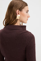 Detail of the asymmetric draped neckline on the Claude Knit