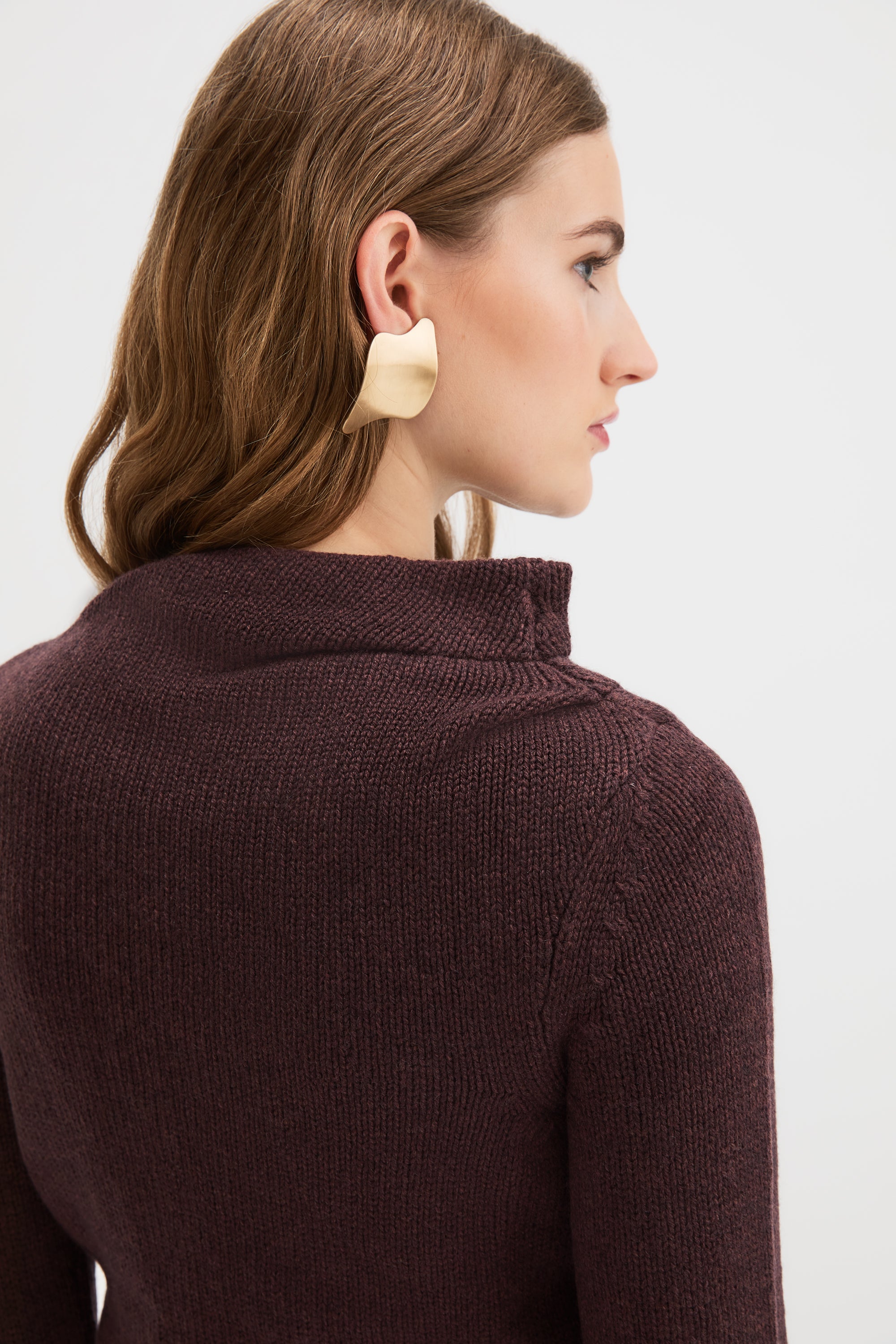 Detail of the asymmetric draped neckline on the Claude Knit