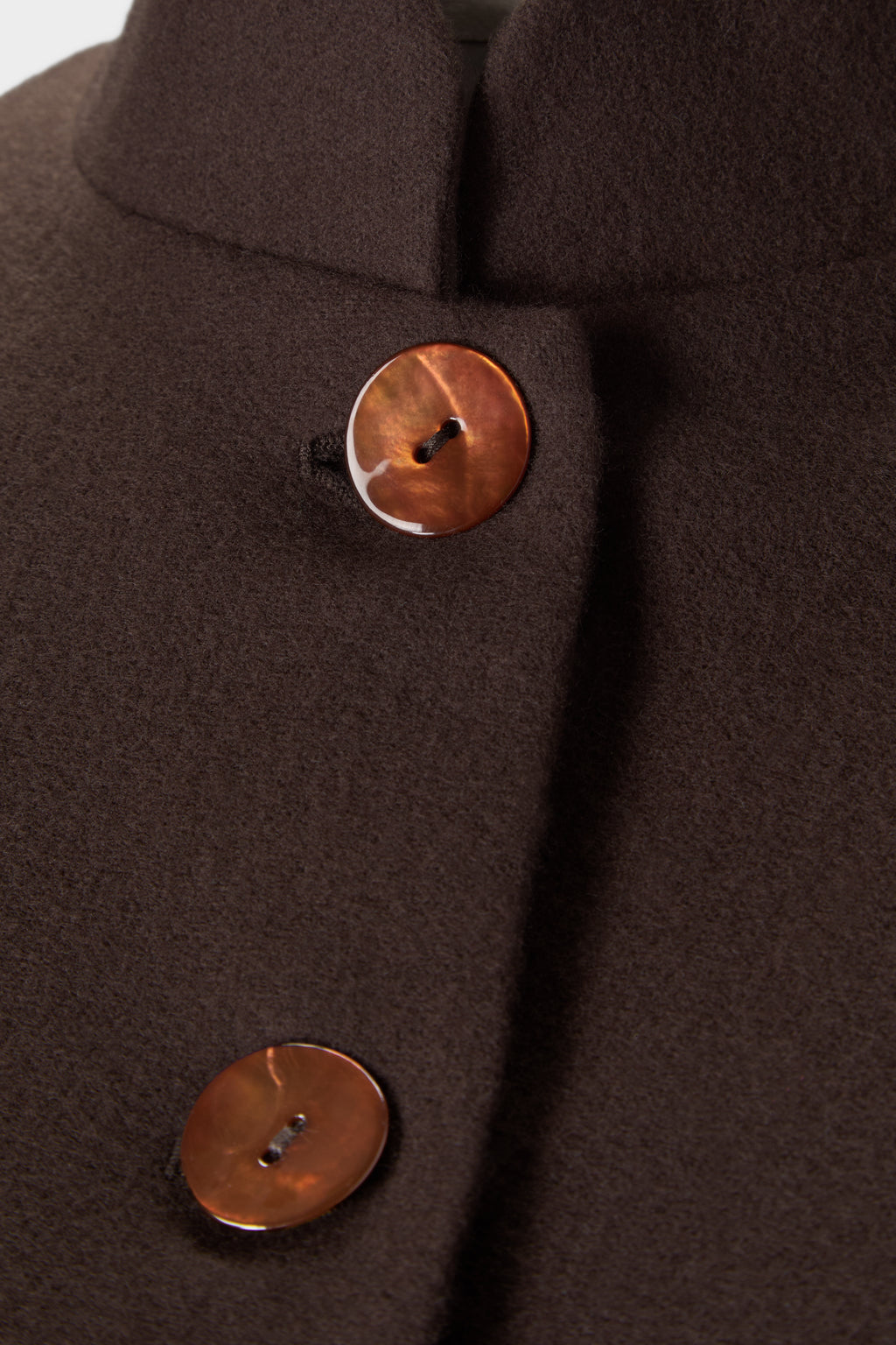 Detail of the mandarin collar and terracotta mother of pearl buttons on the Corbu Jacket